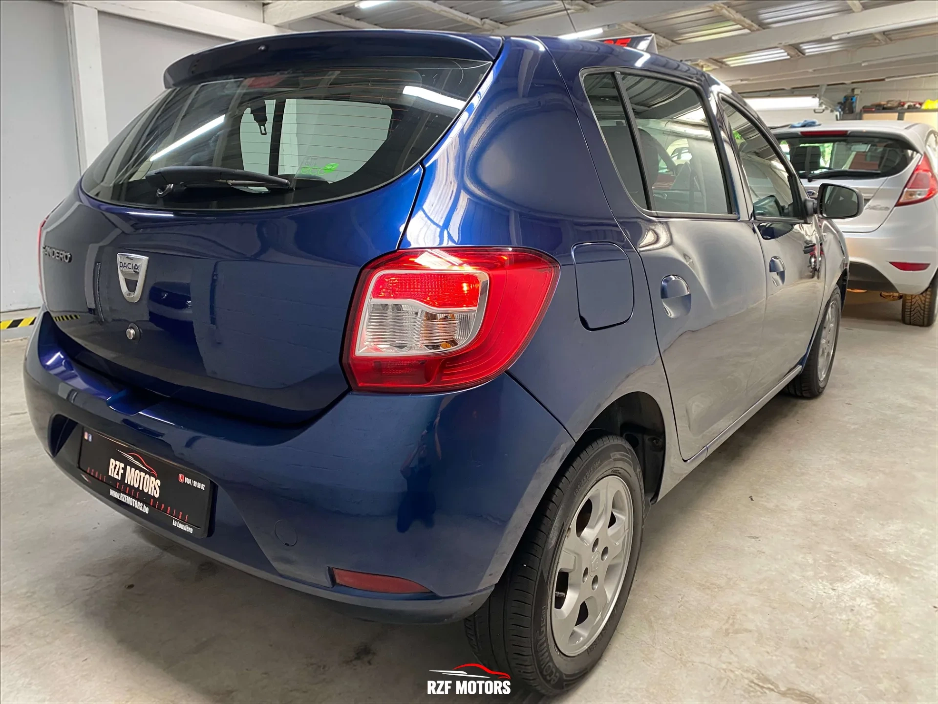 Vue 4 — Véhicule d’occasion Dacia Sandero Celebration 2015